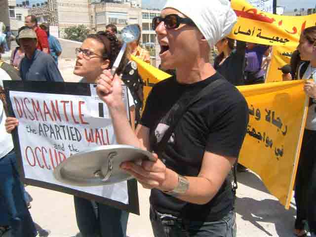 Photo of protest with banners.